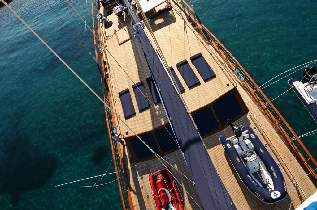 Stunning aerial drone view of S/Y Clear Eyes 141 feet luxury sailing ketch anchored in pristine turquoise waters