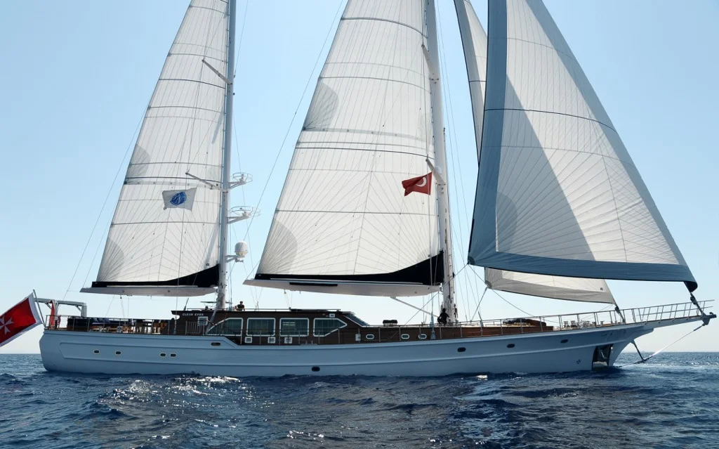Majestic S/Y Clear Eyes luxury yacht with all white sails fully deployed during Mediterranean charter voyage