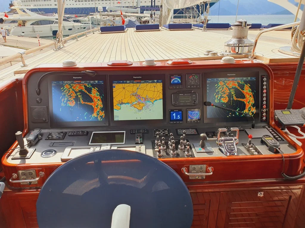 Captain helm station with advanced navigation and communication systems on S/Y Clear Eyes luxury ketch