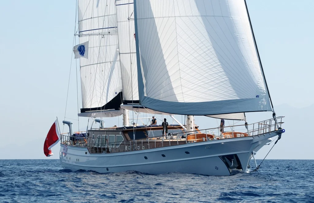S/Y Clear Eyes 141 feet luxury sailing ketch under full sail on turquoise Aegean Sea during private charter cruise